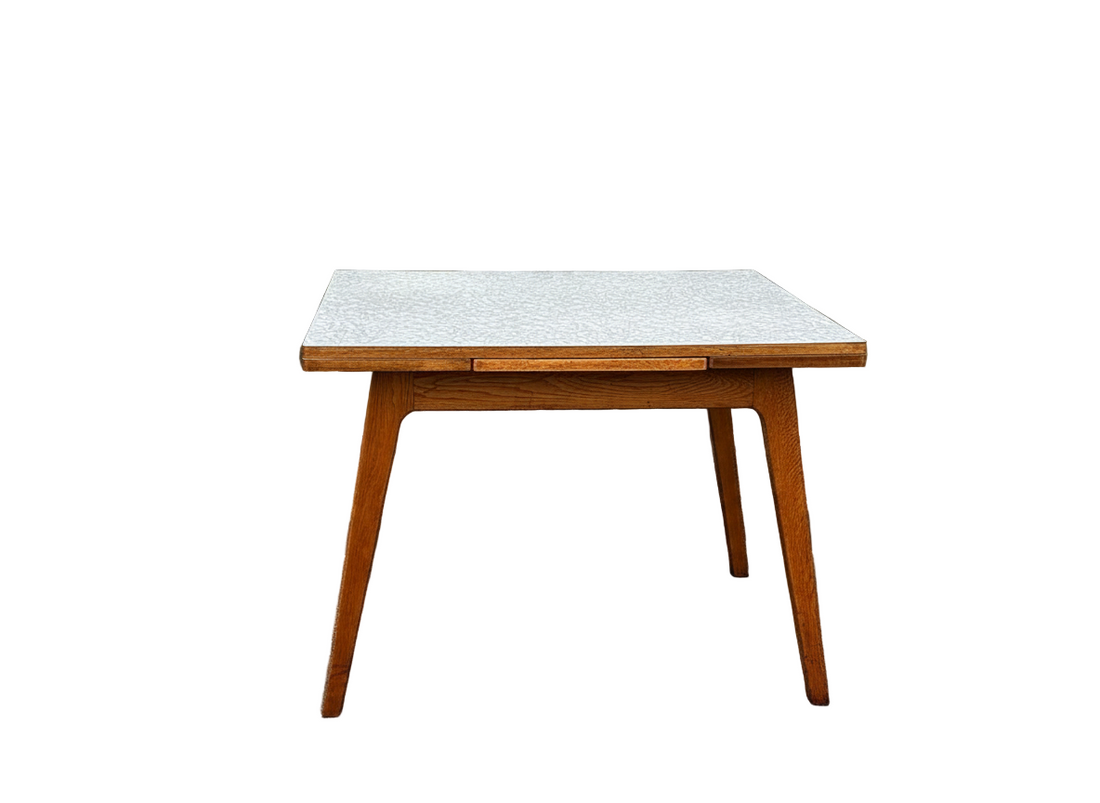 Oak extendable dining table with Formica top
